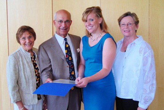 Anna Kilbourn is presented with the "Selig Award for Excellence" by the Farrehi Family Foundation