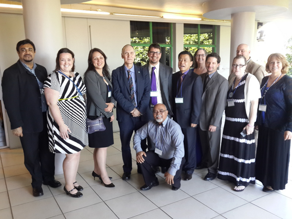 UM-Flint students and faculty with the conference organizers.