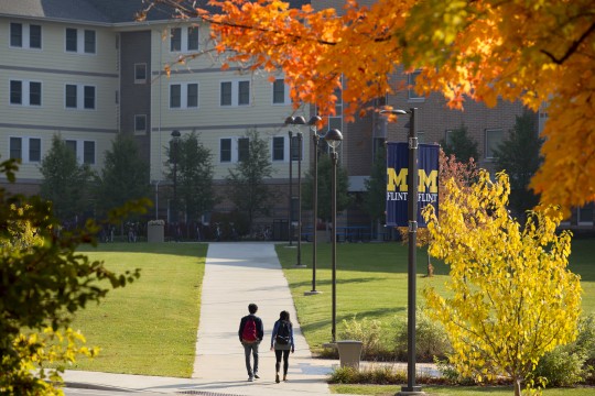 UM-Flint international students walking back from class to the First Street Residence Hall
