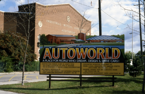 Sign announces plan to transform Flint's IMA Auditorium location into "AutoWorld"