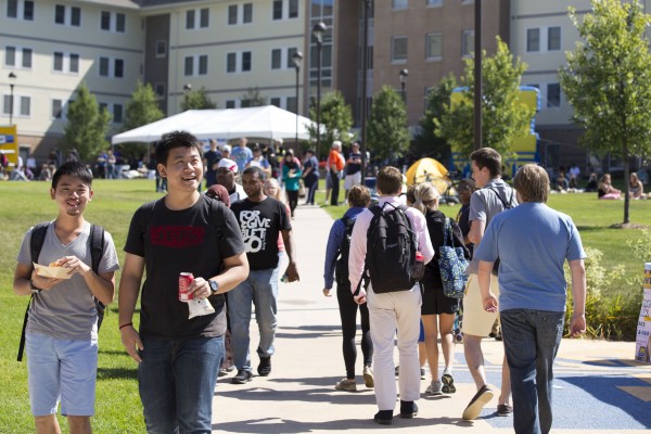 UM-Flint students enjoy picnic outside of First Street Residence Hall