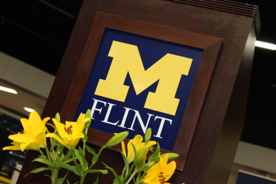 UM-Flint logo adorns commencement podium