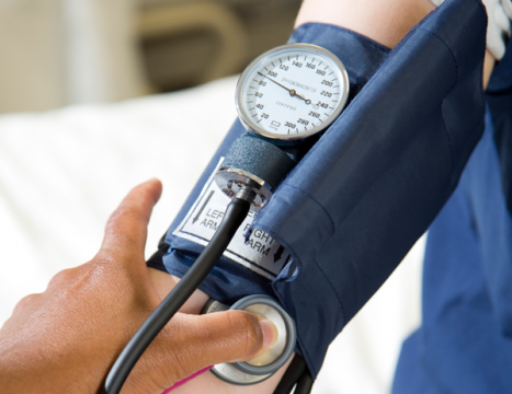 Close-up of taking a patient's blood pressure.