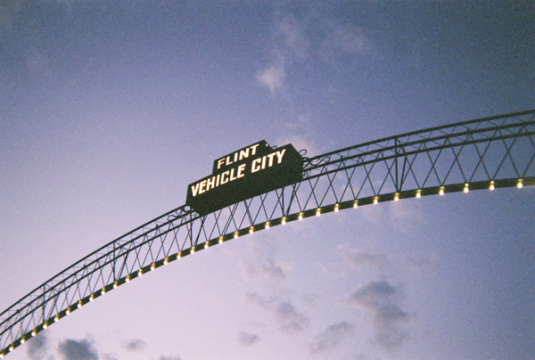 Photo of "Flint Vehicle City" arches at dusk.