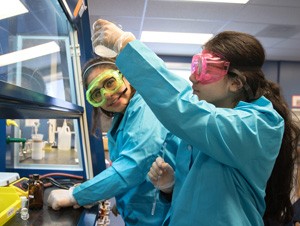 Curiosity Academy participants experimenting with soap.