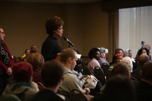 A community member asks Angela Davis about the future of education.