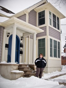 Gabrielle Veal in front of the Urban Alternatives House