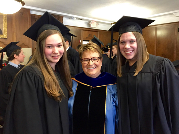 UM-Flint students Rebecca DeJonge (Biology) and Elena Sobrino (Anthropology and Music) with Chancellor Susan E. Borrego at University of Michigan Honors Convocation.