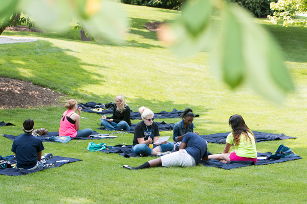 UM-Flint students relaxing in Willson Park.