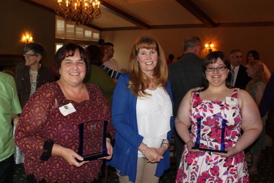 Suzanne Shivnen (left) and Monique Wilhelm (right) were presented with Staff Recognition Awards by Staff Council chair Sandy Alberto (center).