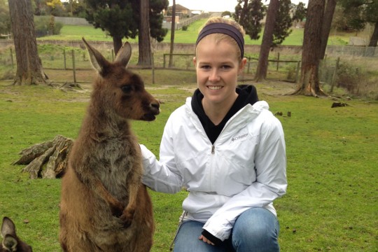 Kayla Bailey with a wallaby in Australia.