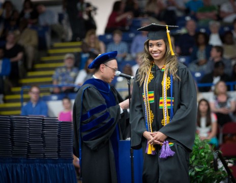Proud UM-Flint graduate receiving her degree.
