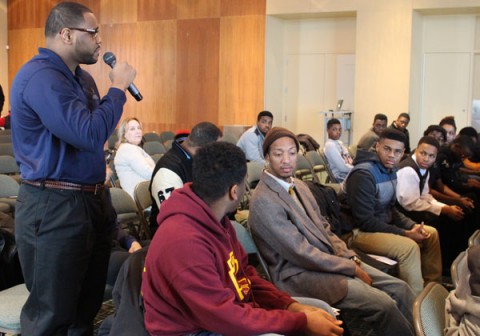 Joe Austin, UM-Flint Star Program student, addresses attendees during a discussion about personal characteristics that shape self-identity and future success.