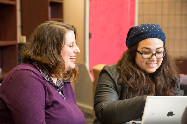 UM-Flint's Ellen Bommarito LGBT Center director talks with a student.