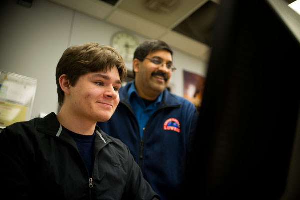 Rajib Ganguly, PhD working with physics and math major Justin Wisby.