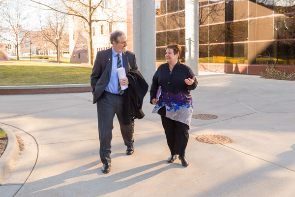 U-M President Mark Schlissel talking with UM-Flint Chancellor Susan E. Borrego on the Flint campus Monday, March 21, 2016.