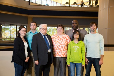 Emeritus Professor of Accounting Walker E. Fesmire with UM-Flint students and others helping out with tax assistance program. 