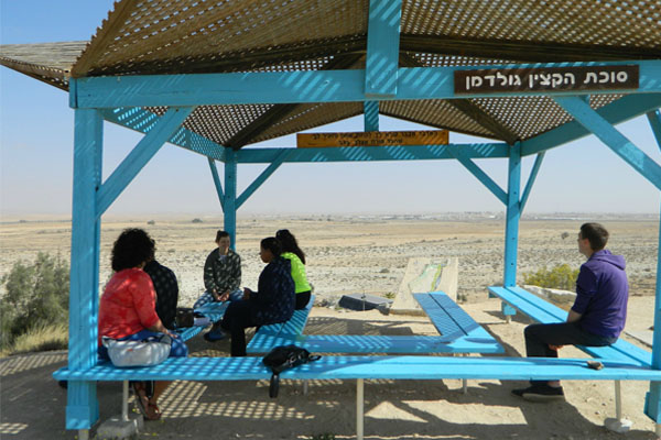 Delegation members, including UM-Flint's Stephanie Gelderloos, pause during a tour of the Nitzana Educational Community.