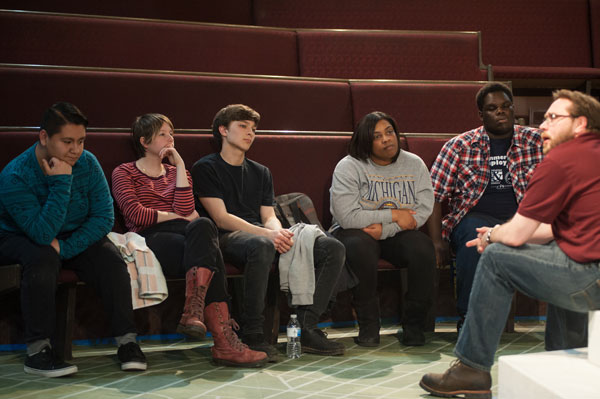 Cast members converse with Jeremy Winchester, executive artistic director of the Flint Youth Theatre and director of the production.