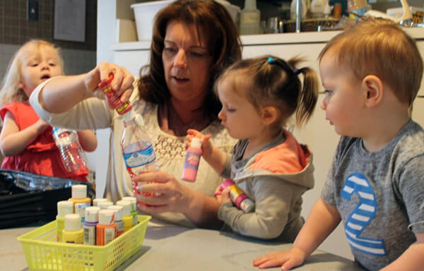 ECDC children help create chandelier.