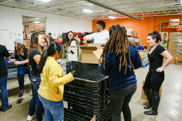 UM-Flint students learn to apply knowledge in real-world contexts, such as this Food Bank of Eastern Michigan distribution center.