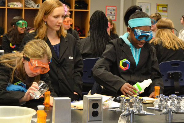 Samantha Grathoff works with students in a Curiosity Academy session at UM-Flint