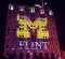 UM-Flint logo projected on Mott Foundation Building