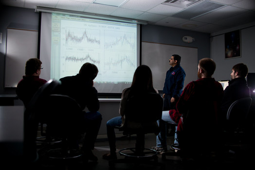 Dr. Ganguly working with UM-Flint Physics students