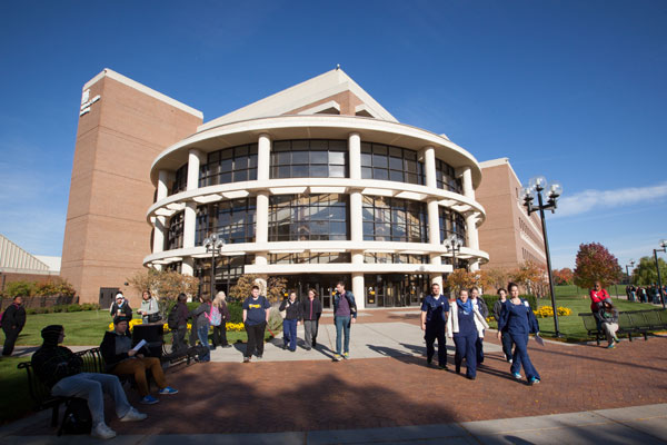 UM-Flint students, faculty, and staff outside of the William S. White Building.