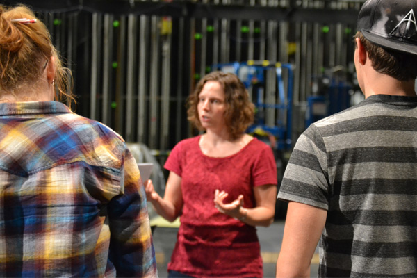 UM-Flint Theatre's Stephanie Dean talks with student cast members during a rehearsal of "Next to Normal."