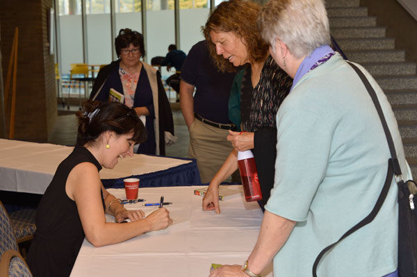 Tracie McMillan signs copies of her book "The American Way of Eating" at UM-Flint.