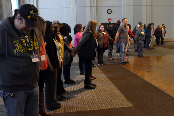 Social work students and staff begin to step apart in response to faculty-led questions.