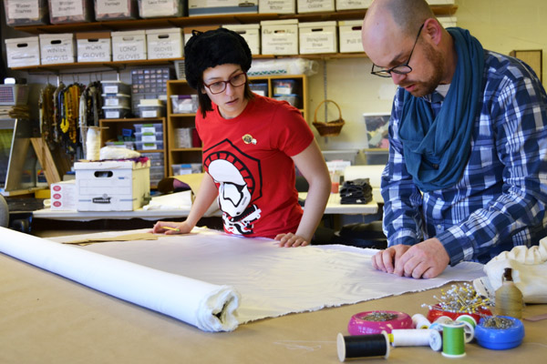 Adam Dill of UM-Flint Theatre working with a student in the university's Costume Shop