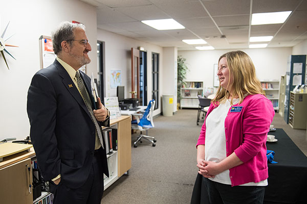 Sara McDonnell speaking with President Schlissel about the MapFlint project
