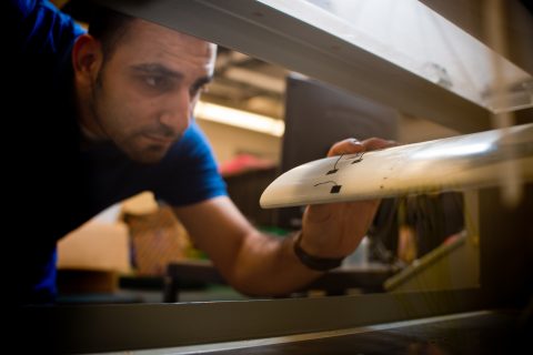 A UM-Flint mechanical engineering student utilizing a wind tunnel.