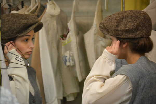 Banister gets into character during a costume fitting.