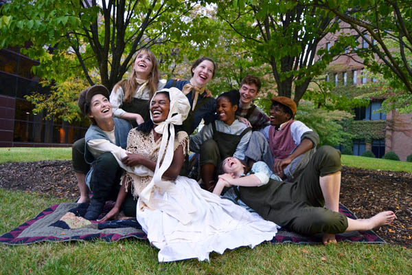 Cast members, including Banister (far left), pose during a publicity photoshoot.