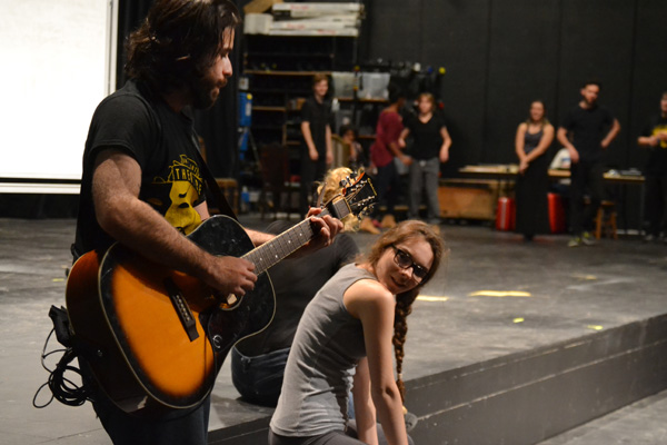 UM-Flint Theatre student Seth Hart plays guitar during rehearsal of Shakespeare's "As You Like It."