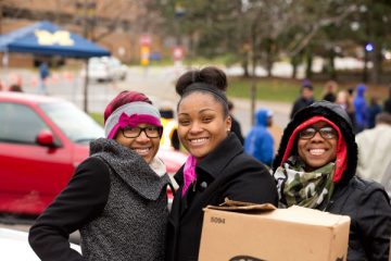 UM-Flint students volunteer at annual Holiday Food Giveaway.