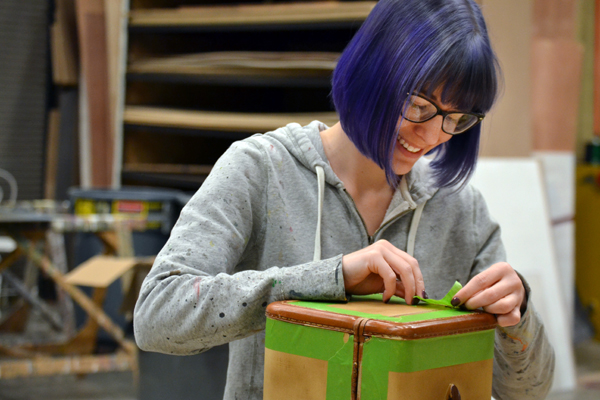 Scenic Designer Lisa Borton works on props for the UM-Flint Theatre production of "Lend Me a Tenor." She also worked as costume designer for this production.