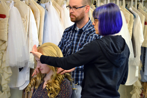 Lisa Borton discusses styling decisions with Costume Shop Supervisor Adam Dill.