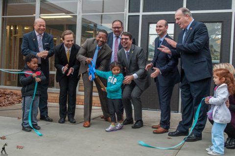 Cutting the ribbon to open the Cummings early childhood center.