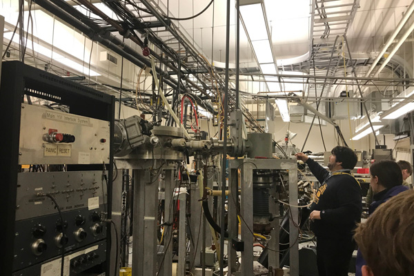 A highlight of Bakhsh's time at the physics conference: a positive ion particle accelerator tour.