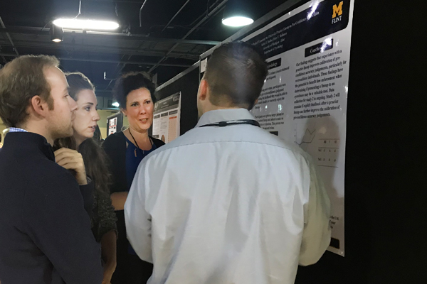 UM-Flint Psychology research assistants discuss their findings with AP-LS conference attendees 