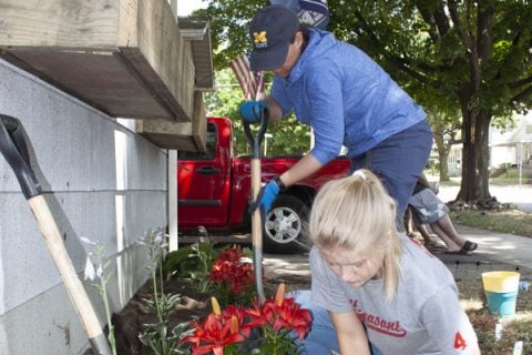 UM-Flint assistant professor of biology Dr. Rebecca Tonietto, and student Megan Cate working on The Porch Project.