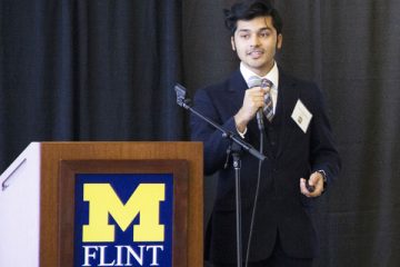 UM-Flint computer science student Nickxit Bhardwaj delivers his internship presentation