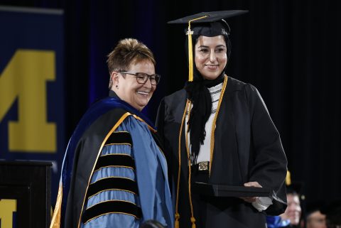 Chancellor Borrego congratulates Aisha Changezi on receiving her bachelor of fine arts degree.