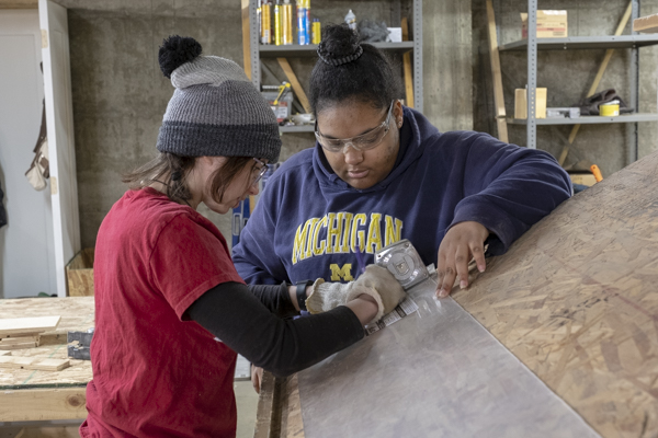 UM-Flint students built "little libraries" at Genesee County Habitat for Humanity on MLK Day 2019.