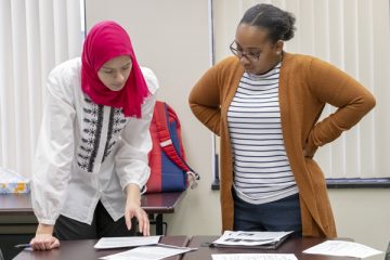 Students prepare for their service-learning class within the Teaching English to Speakers of Other Languages (TESOL) certificate program.