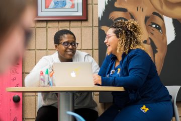 Peer educators Niyah Lewis and Marissa Charles working in the Center for Gender and Sexuality